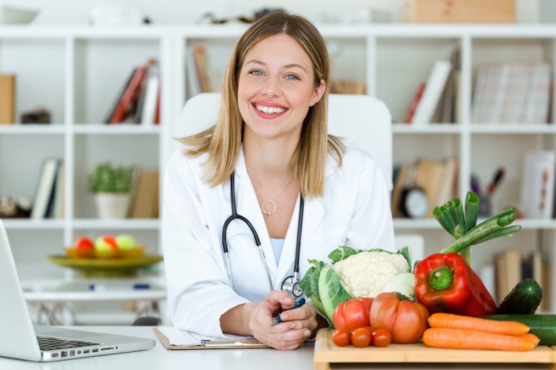 smiling nutritionist looking at camera