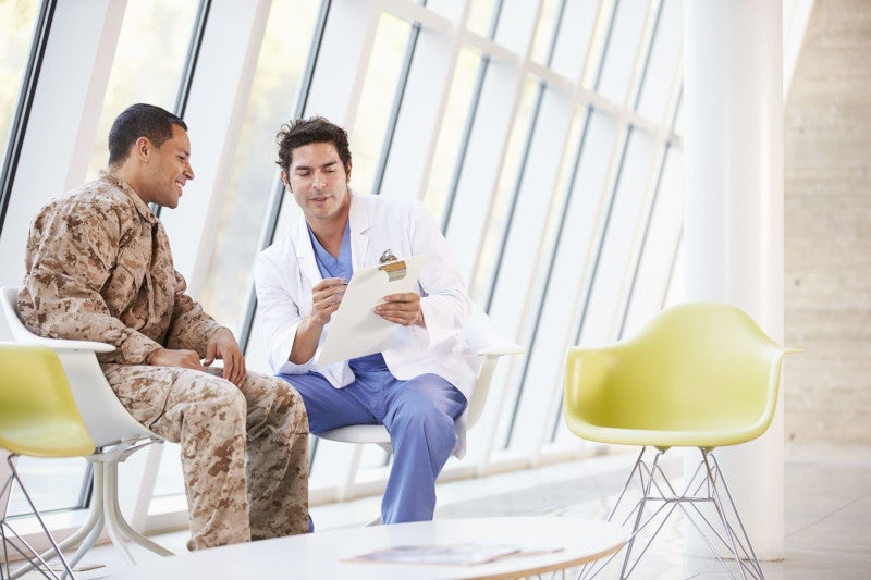 doctor counselling soldier