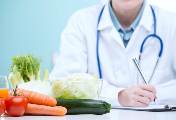 Doctor prescribing diet interventions for SIBO